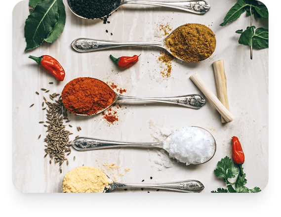 Colorful Asian spices arranged in spoons