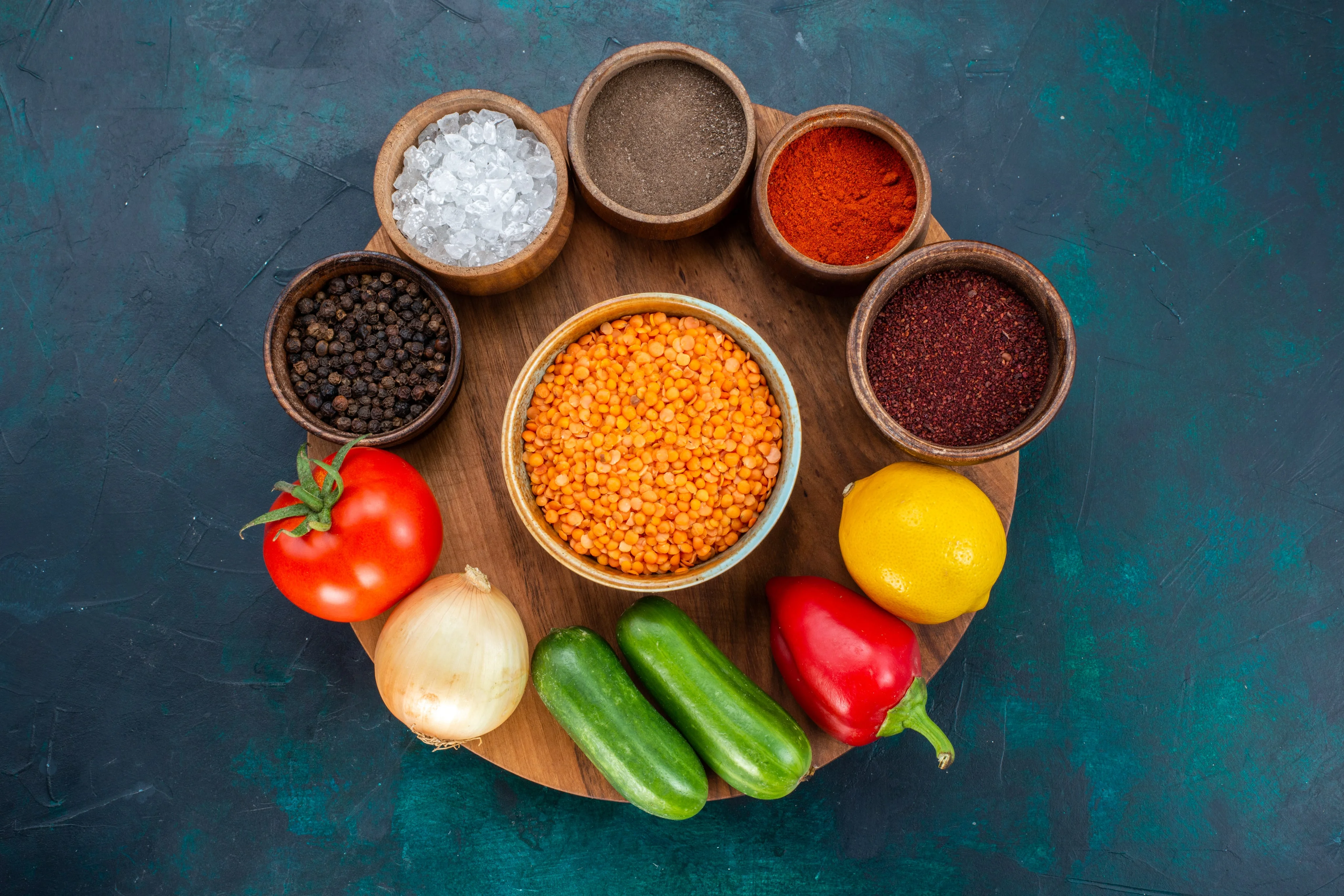 Bowl of lentils, spices, and fresh vegetables